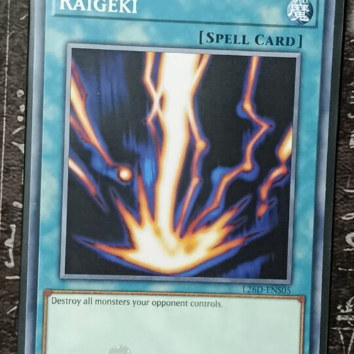 Raigeki Yu-Gi-Oh! spell card with Ultra Pro sleeve and Top Loader