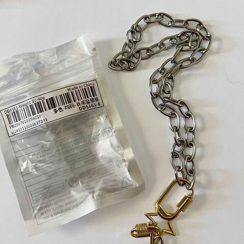 Long pendant with silver chain and gold rings, star and diamond-shaped drop