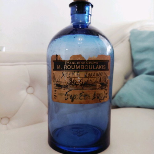 Vintage blue glass bottle used from the 1960s
