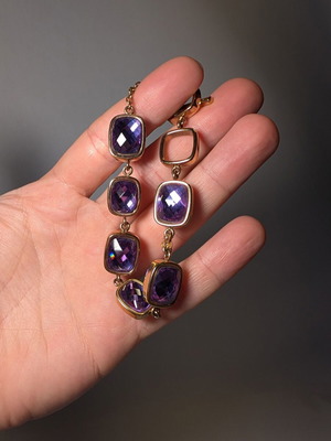 Bracelet in gold tone with purple stones used