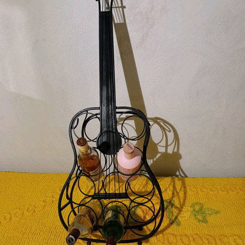 Metal guitar stand used for bottles vintage