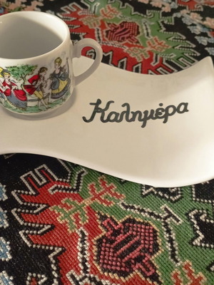 Porcelain coffee coaster with "Good Morning" print used