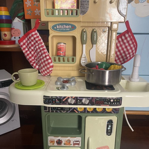 Children's play kitchen with many accessories