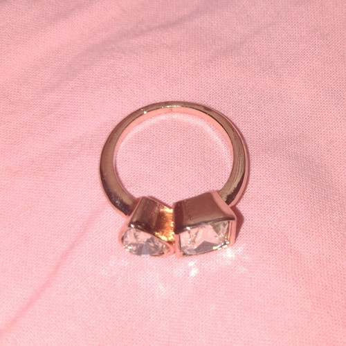 Rose gold ring with faceted rectangular and round stones