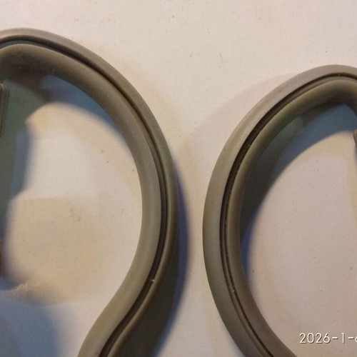 Over the ear headphones used with anatomical tube behind the ear