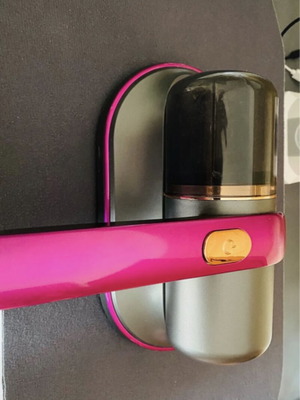 Portable vacuum cleaner for mattresses and fabrics, fuchsia and grey