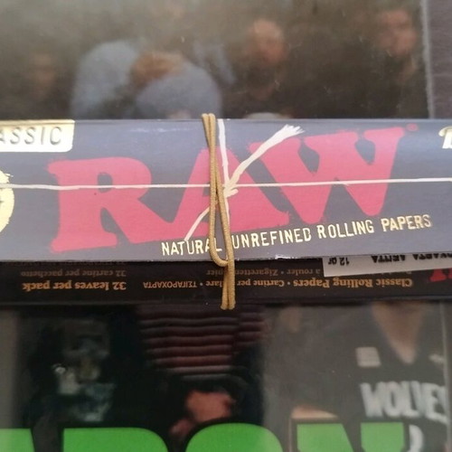 Classic Raw Black rolling papers used, about 16 sheets