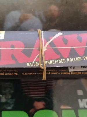 Classic Raw Black rolling papers used, about 16 sheets