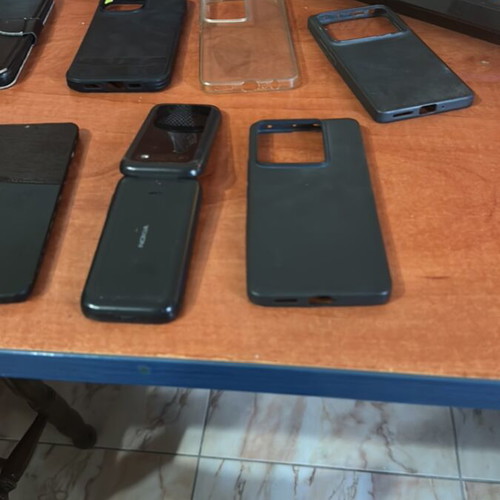 iPhone 14 Pro Max cases and accessories, 3 phones, 2 working, headphones