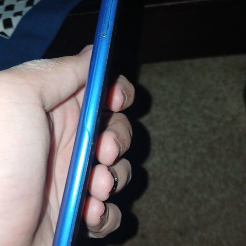 Alcatel phone used with cracks and scratches blue