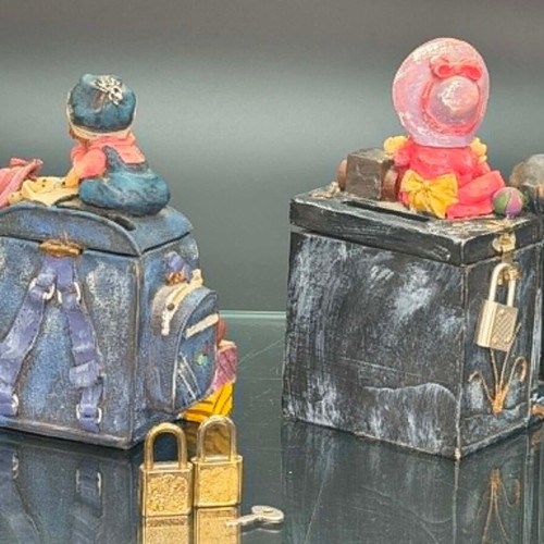 Vintage polyresin piggy banks with three locks and working key