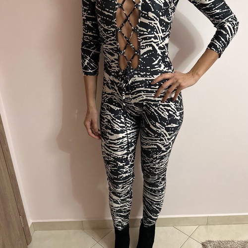 One-piece jumpsuit used, one size with zipper on back