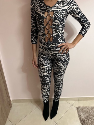 One-piece jumpsuit used, one size with zipper on back