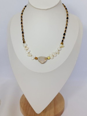 Solar Balance necklace new with black beads, shells, and gold details