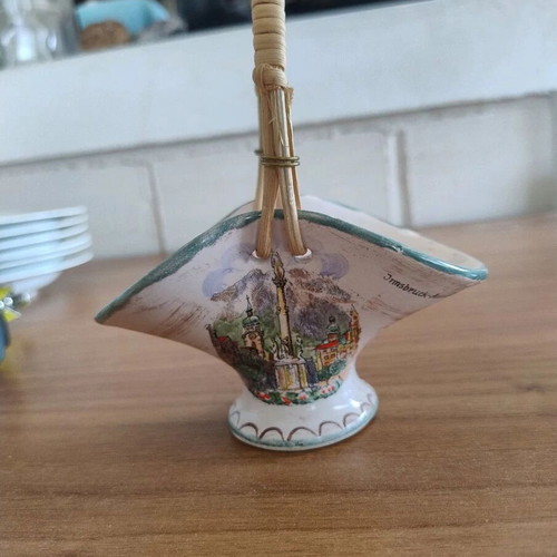 Decorative small ceramic basket used with wear marks