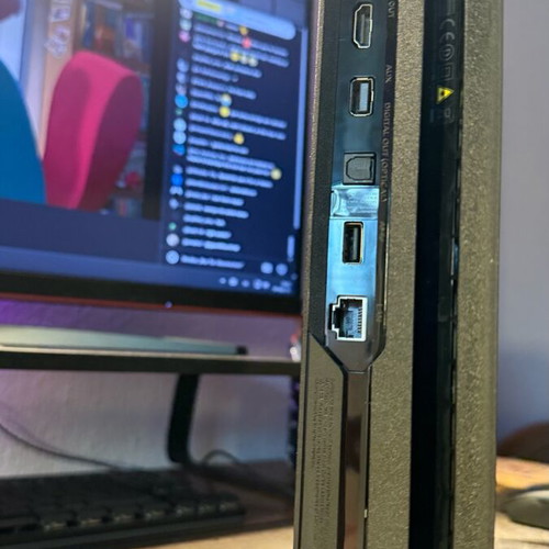 PlayStation 4 Pro used with controller and two games