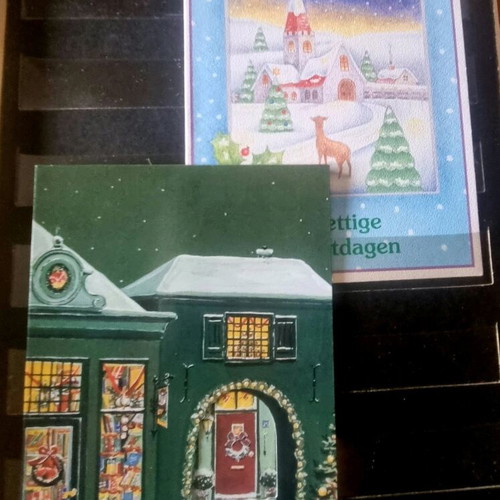 Vintage festive album with 80 cards like new