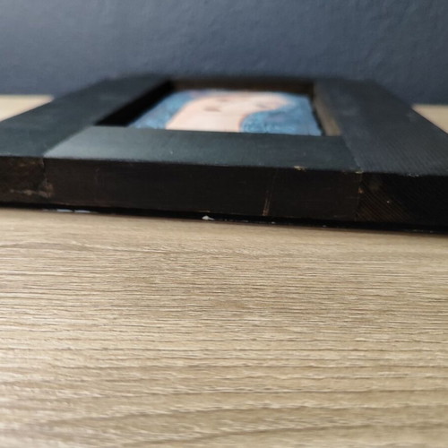 Vintage ceramic tile portrait of a woman with wooden frame used