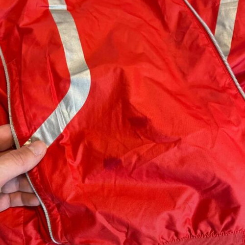Ducati team jacket used, moderate condition with holes and stains