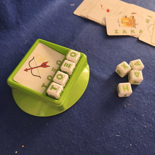 Educational game used for first words and syllables with alphabet cubes