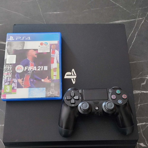 PlayStation 4 Pro 1TB console used with controller and FIFA 21 game