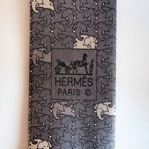 Hermes silk tie with elephant pattern, like new, gray beige