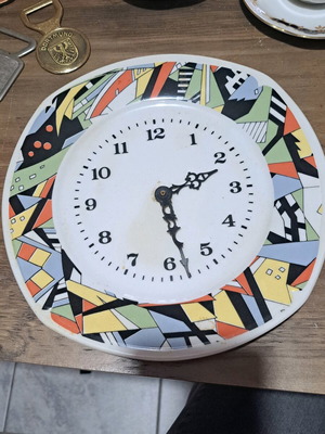 Vintage wall clock made from ceramic plate used