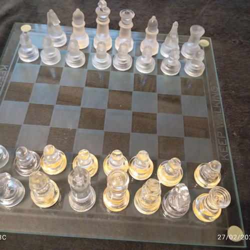 Glass chessboard used, missing one rook