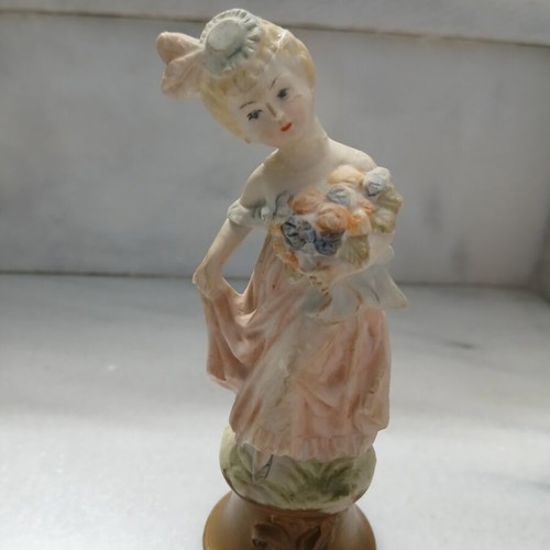 Vintage decorative figurine small lady with atmospheric details