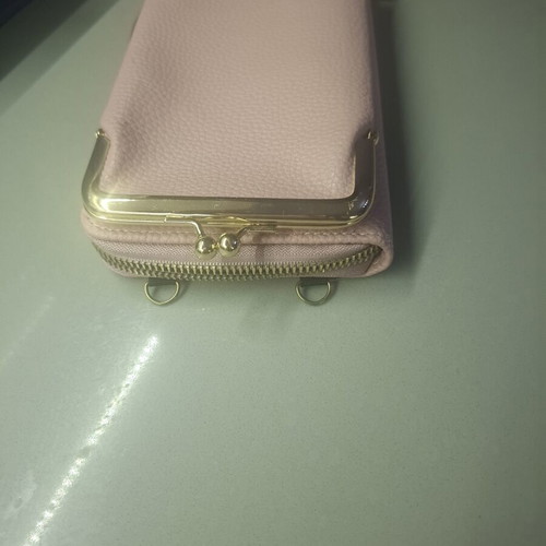 Pink wallet with strap and multiple compartments