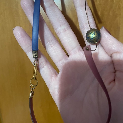 Long necklace used with gold-plated multicolor beads and plastic parts