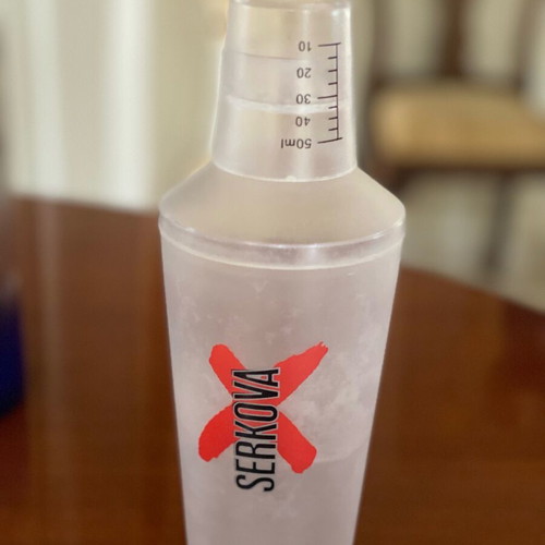 Empty premium liquor bottles and cocktail shaker like new