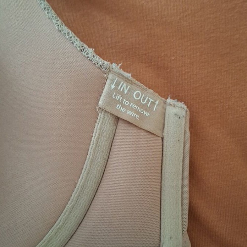 Beige bra new with small front tear