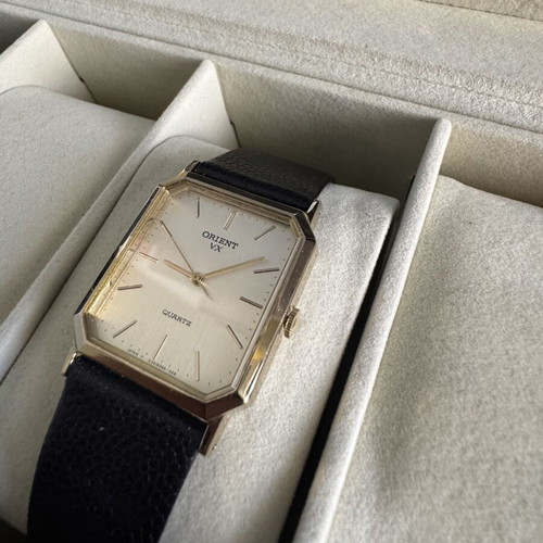 Orient VX Quartz watch, vintage gold rectangular case, brown leather strap