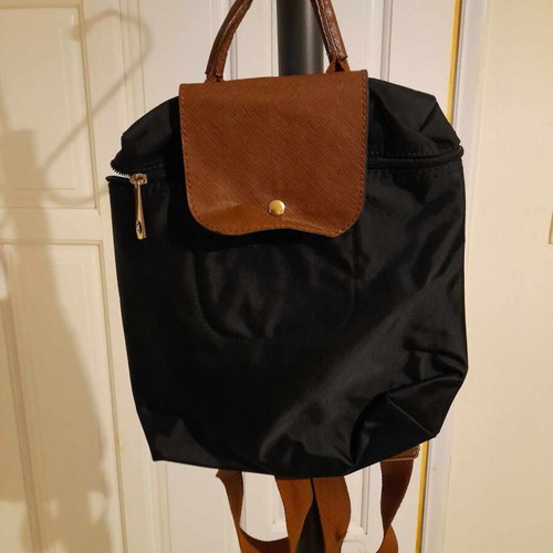 Black backpack with brown flap