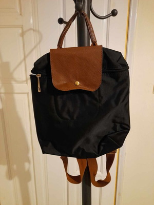 Black backpack with brown flap