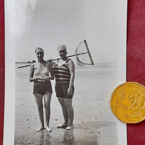 Vintage photo Trouville 1929 women in swimsuits with wooden net