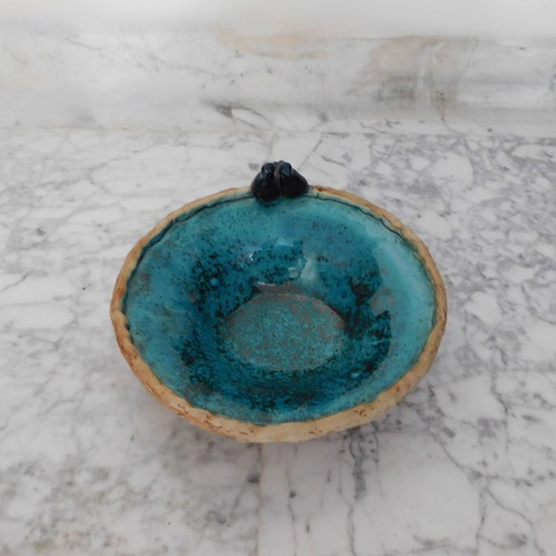 Decorative handmade ceramic plate with turquoise glaze, vintage, like new