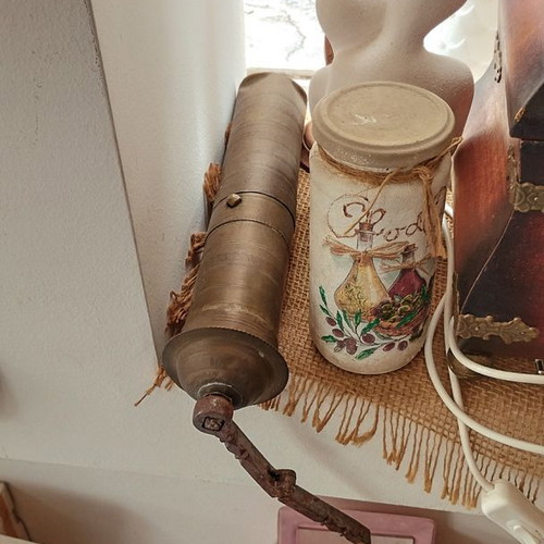 Old traditional brass manual coffee grinder used