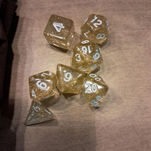 Brown leather dice bag with golden flaked D&D dice set