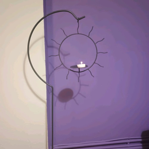 Handmade floor candlestick with hanging sun, like new, 1m height