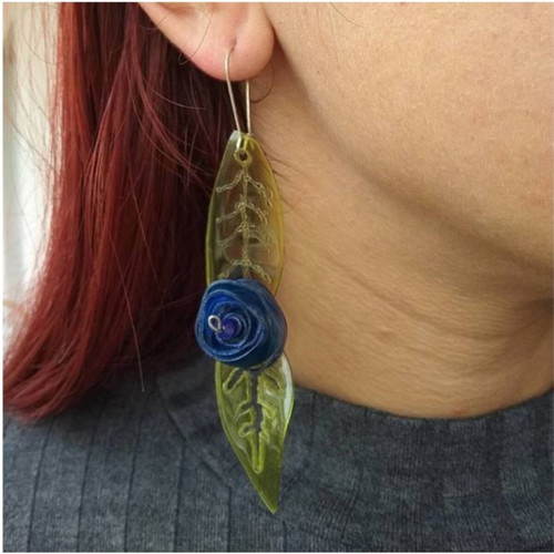 Earrings handmade from scratch with blue and green recycled plastic flowers and leaves