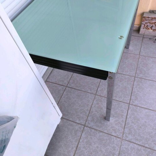 Extendable dining table with four chairs used, leather seats