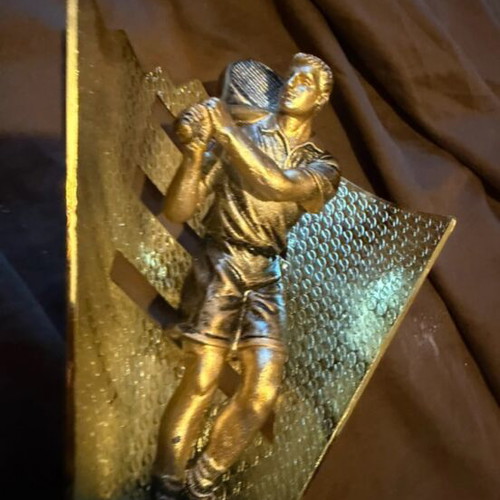 Award trophy used with tennis player figure for padel tournaments