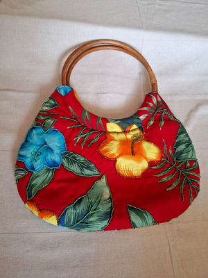 Handbag like new with wooden handle and colorful floral design