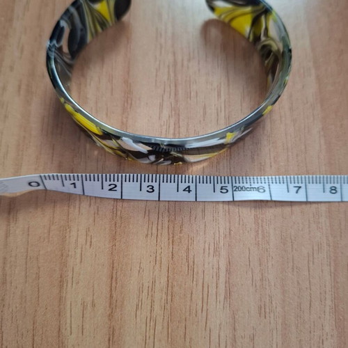 Plastic bracelet like bone colored like new