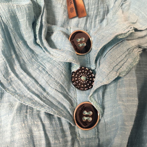 Blouse sleeveless turquoise size S used with decorative buttons
