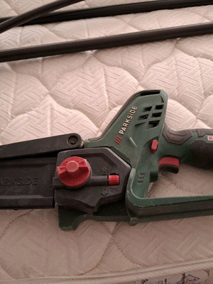 Chainsaw used with battery and charger