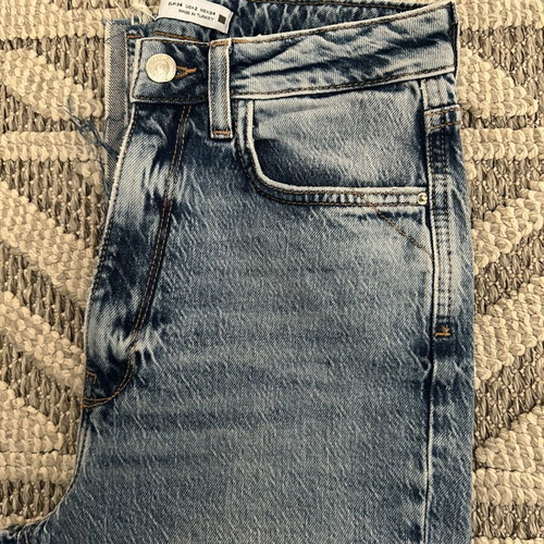 Zara women's jeans new, light blue with rips and frayed hems, size 34