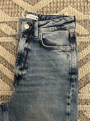 Zara women's jeans new, light blue with rips and frayed hems, size 34
